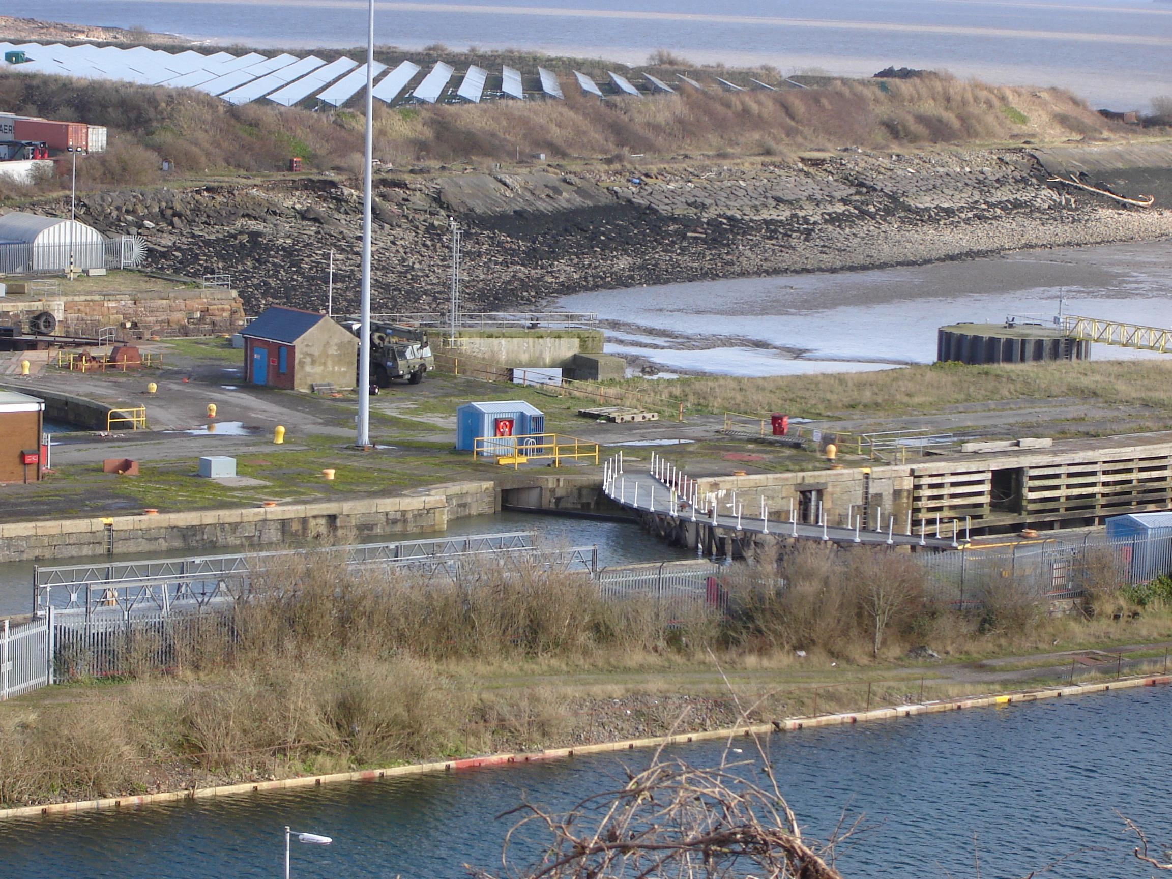 Barry Docks Sea Lock with a 21st century Solar Farm in the background.